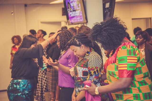 Lady Pastor Clara Laying Hands on Women of Destiny Partners